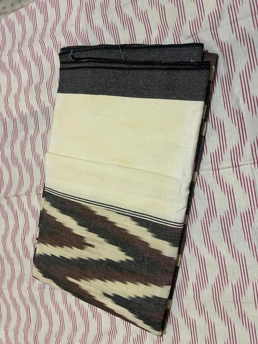 Product image: cream, black, and brown folded saree-like textile