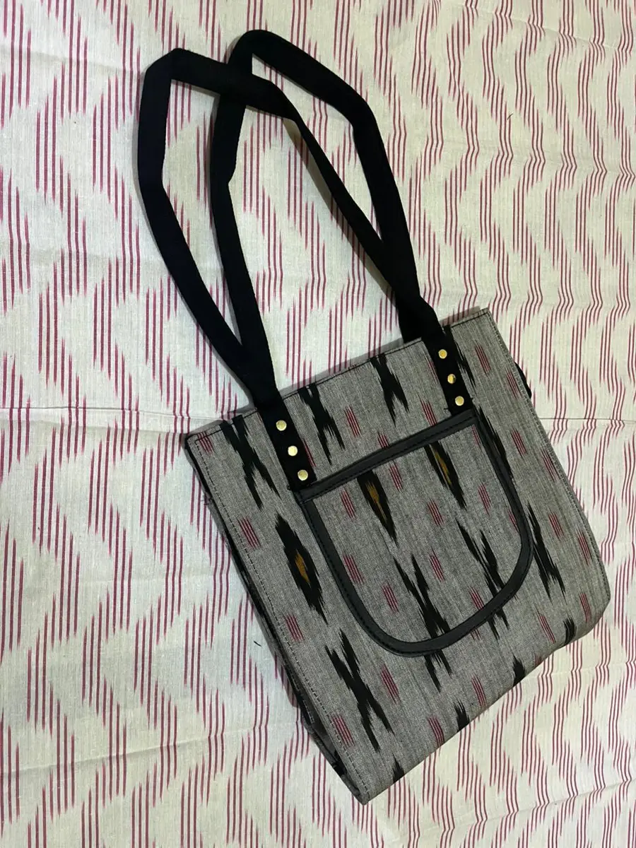 Product image: gray and black handbag