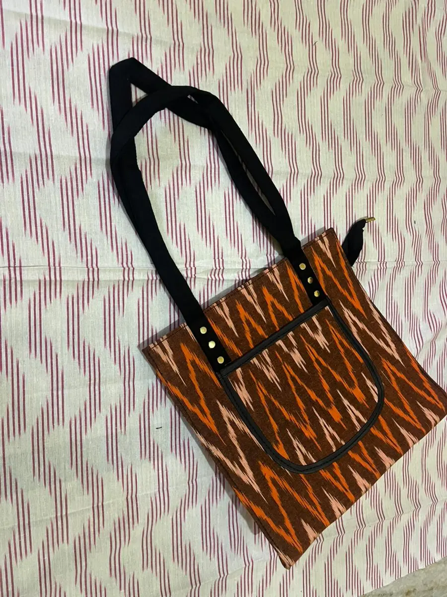 Product image: orange and black handbag