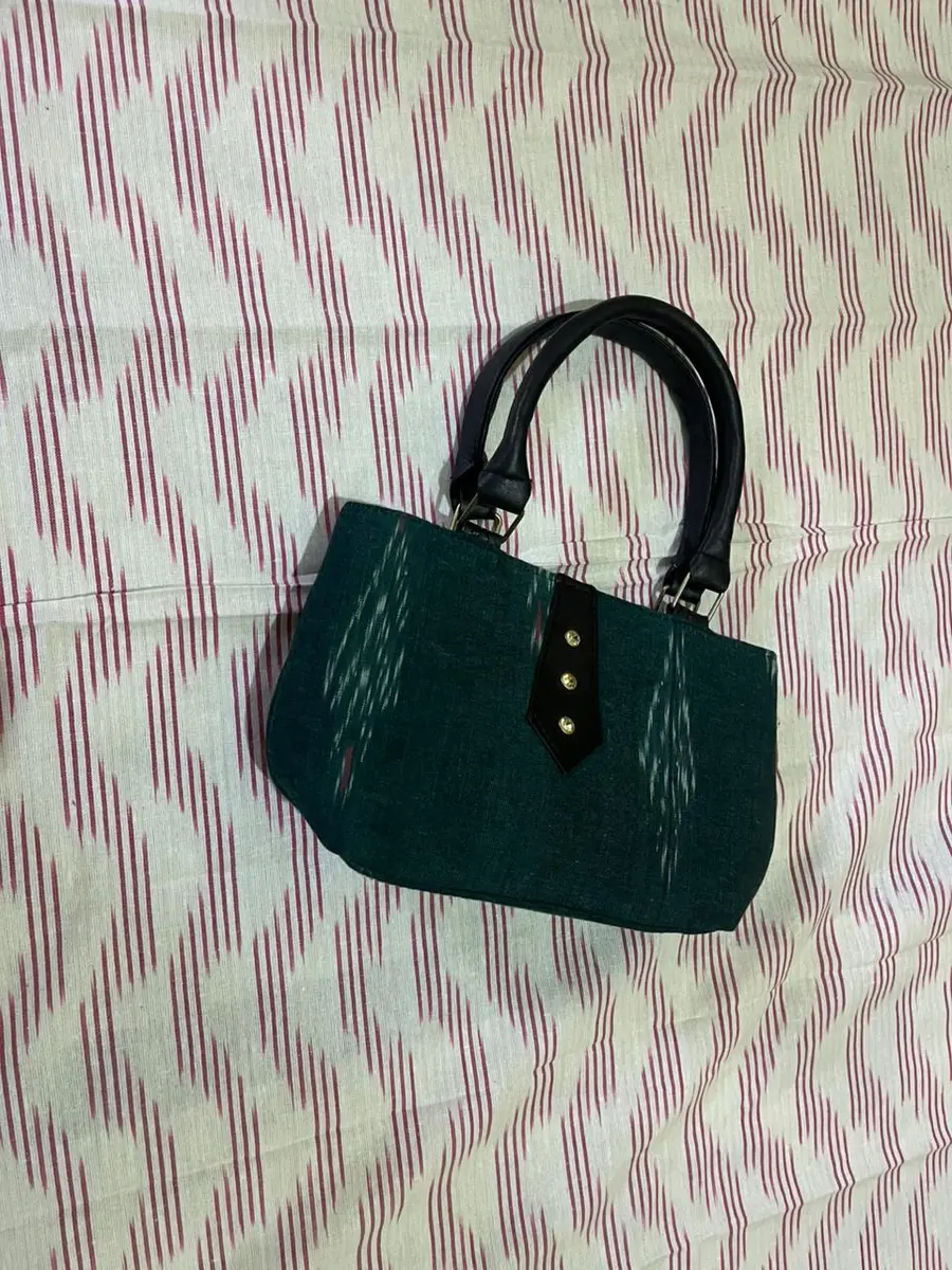 Product image: teal and black handbag