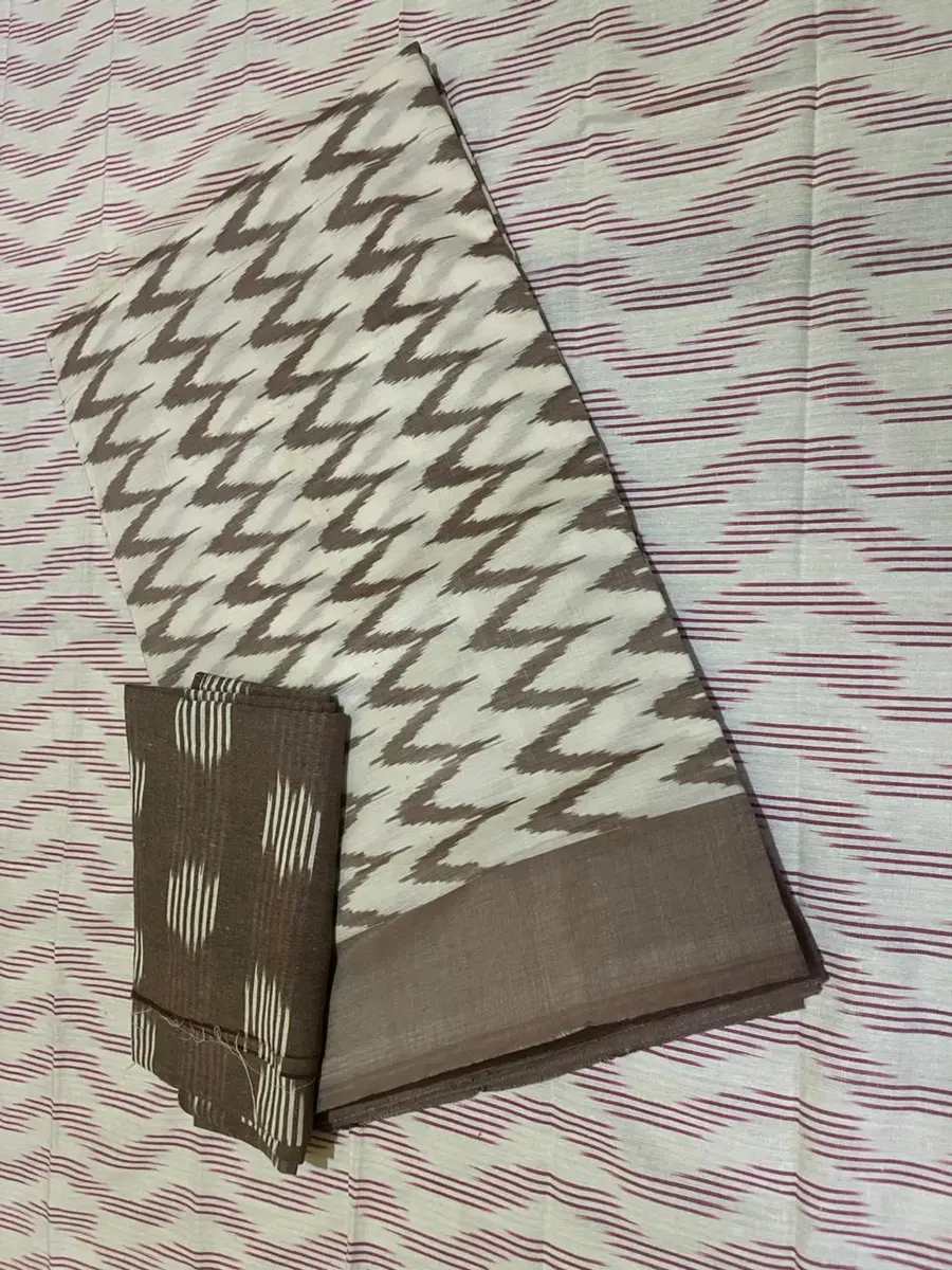 Product image: cream, gray, and brown folded saree-like textile