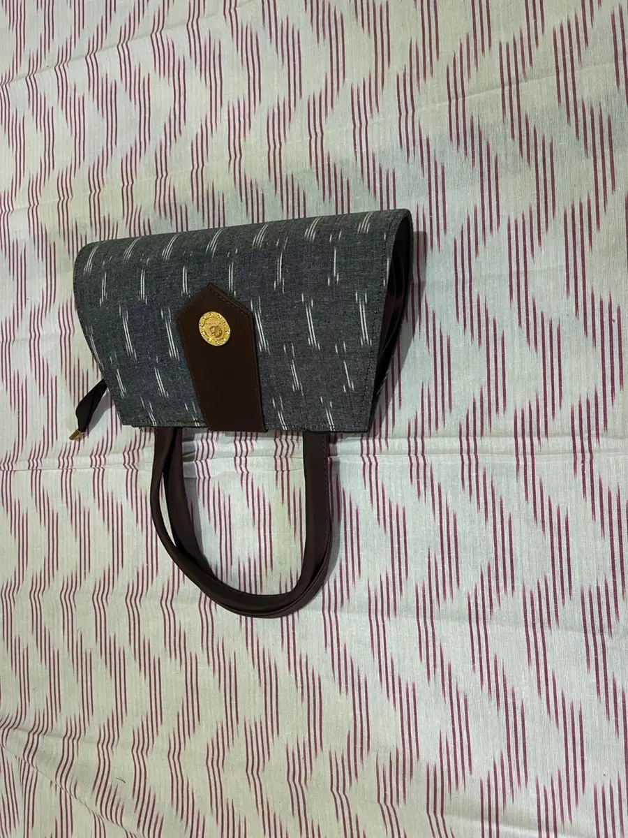 Product image: gray and black handbag
