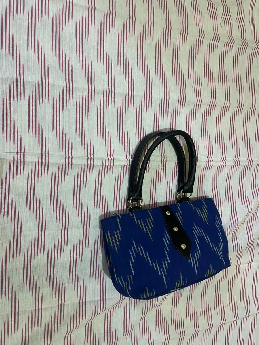 Product image: navy blue and black handbag