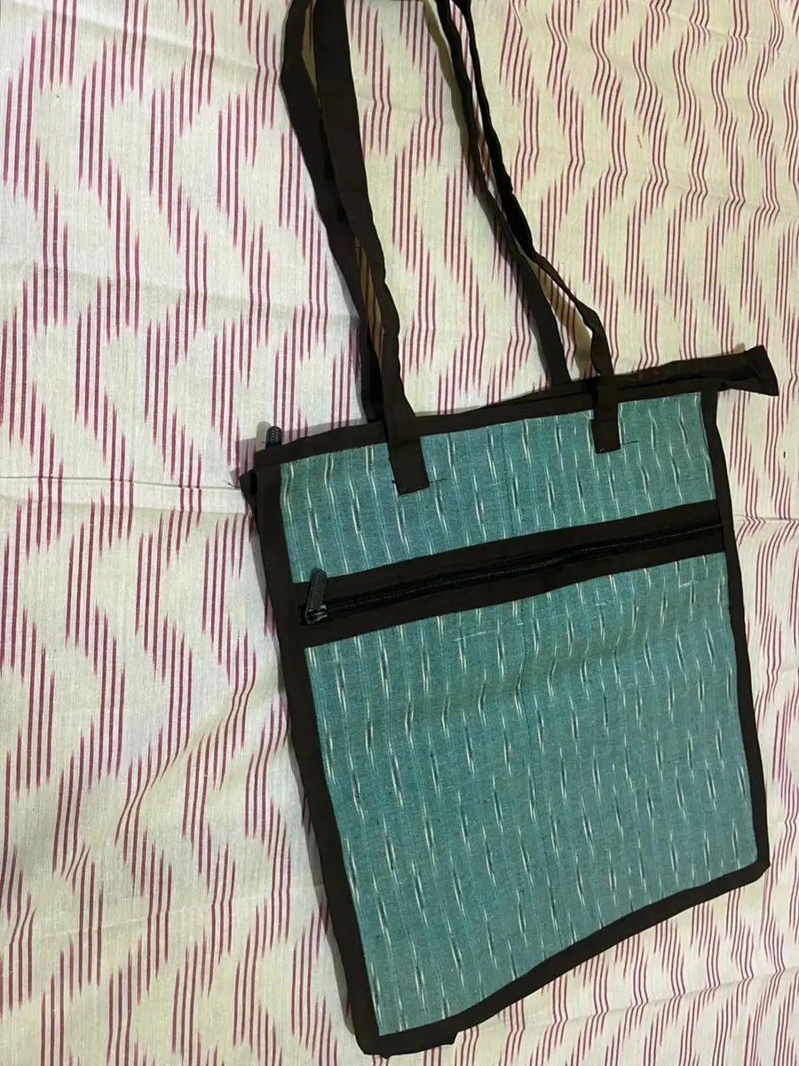 Product image: teal and black handbag