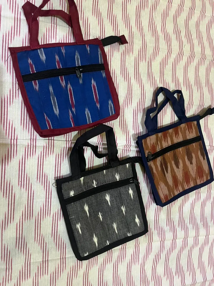 Product image: blue, black, and tan assorted small handbags
