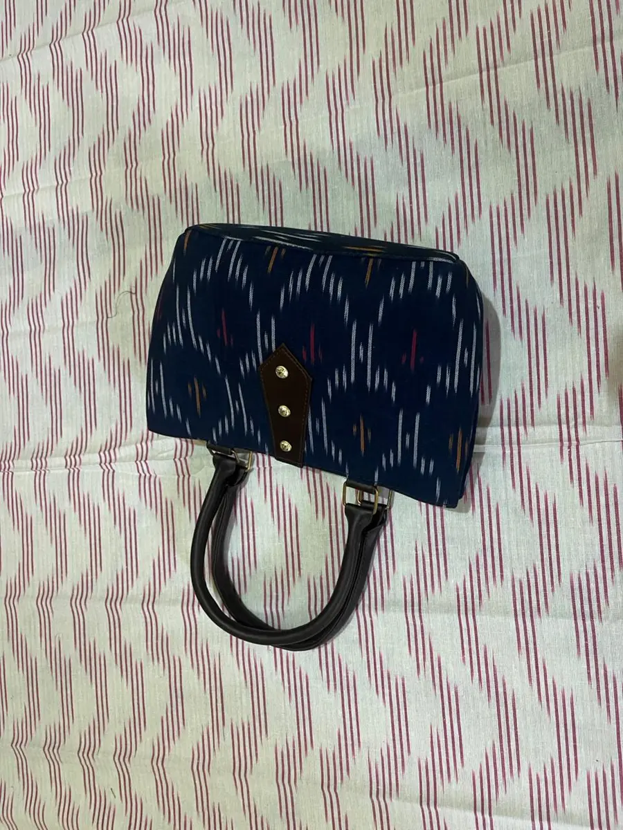 Product image: navy blue and black handbag