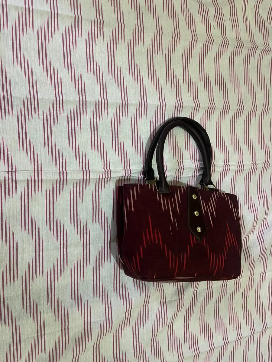 Product image: maroon and black handbag