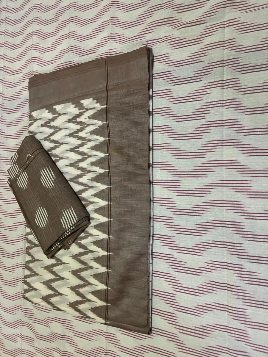Product image: cream, gray, brown, and black folded saree-like textile