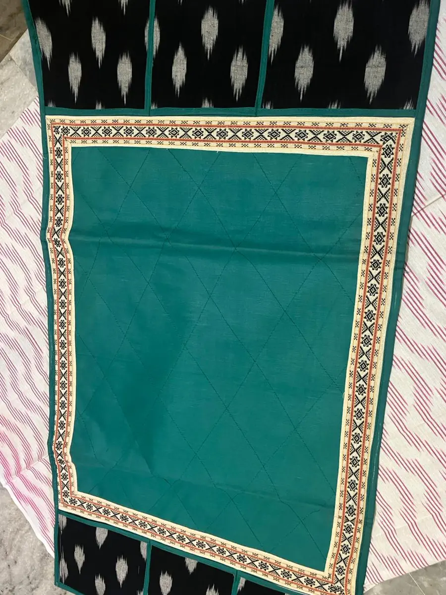 Product image: teal, black, and cream decorative rectangular textile