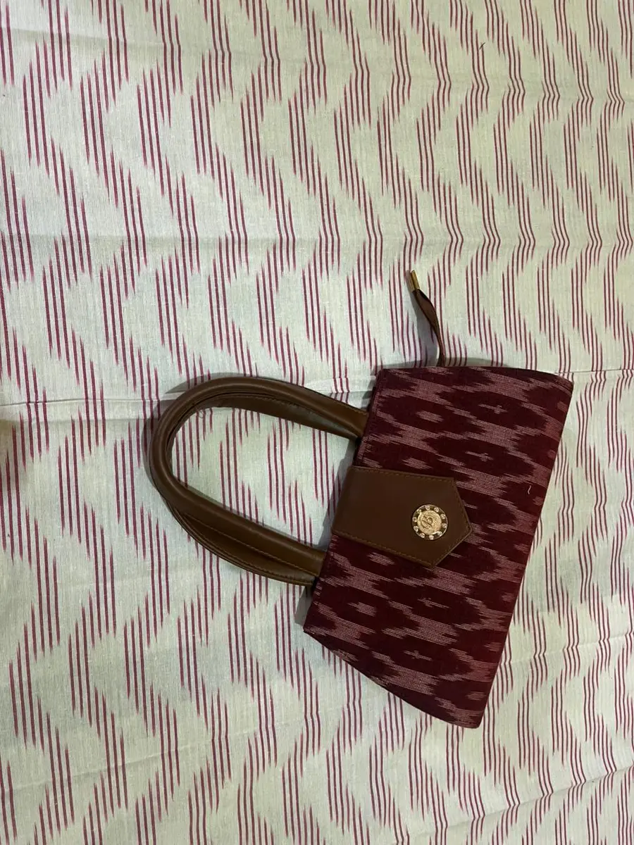 Product image: maroon and brown handbag