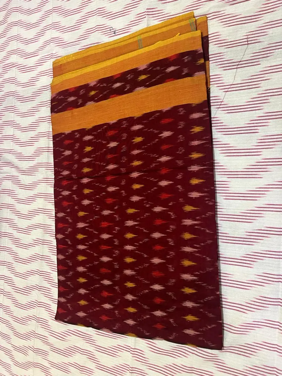 Product image: maroon, mustard, and orange folded saree-like textile