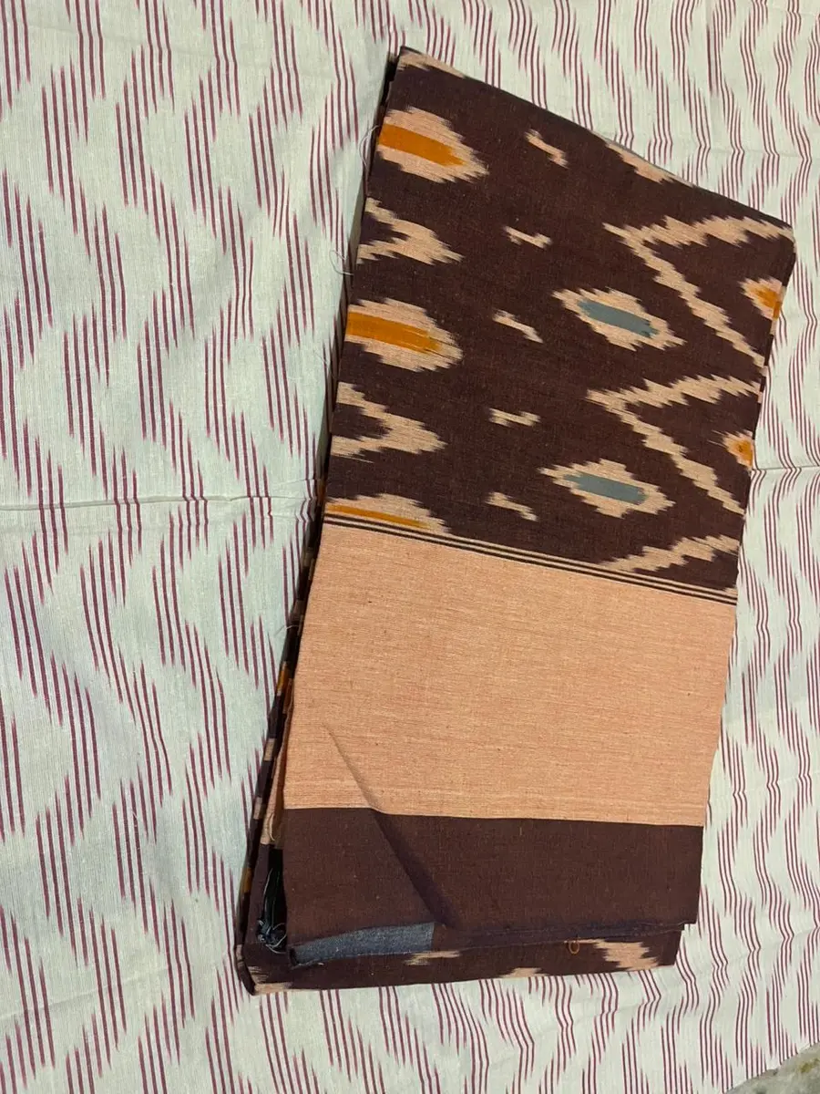 Product image: brown, black, and peach folded saree-like textile