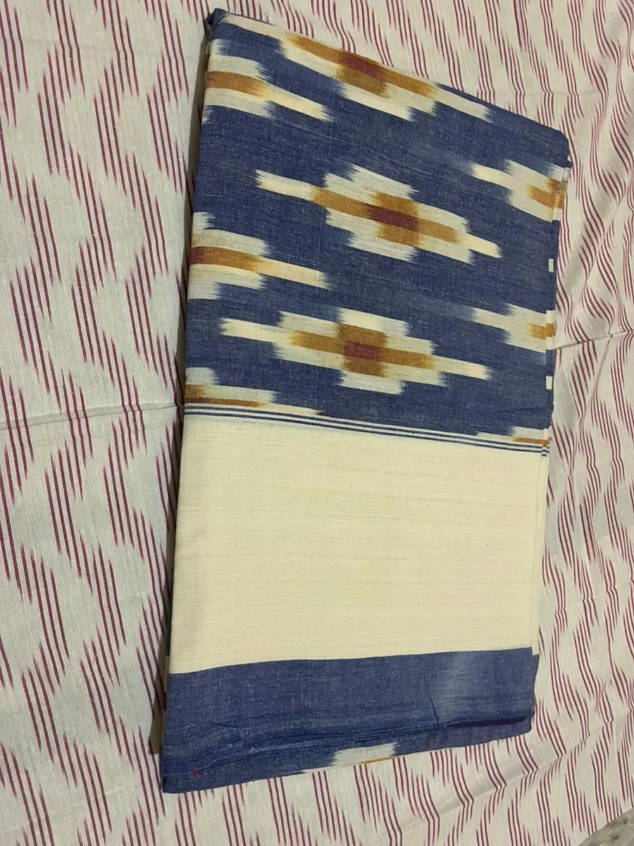 Product image: cream and navy blue folded saree-like textile