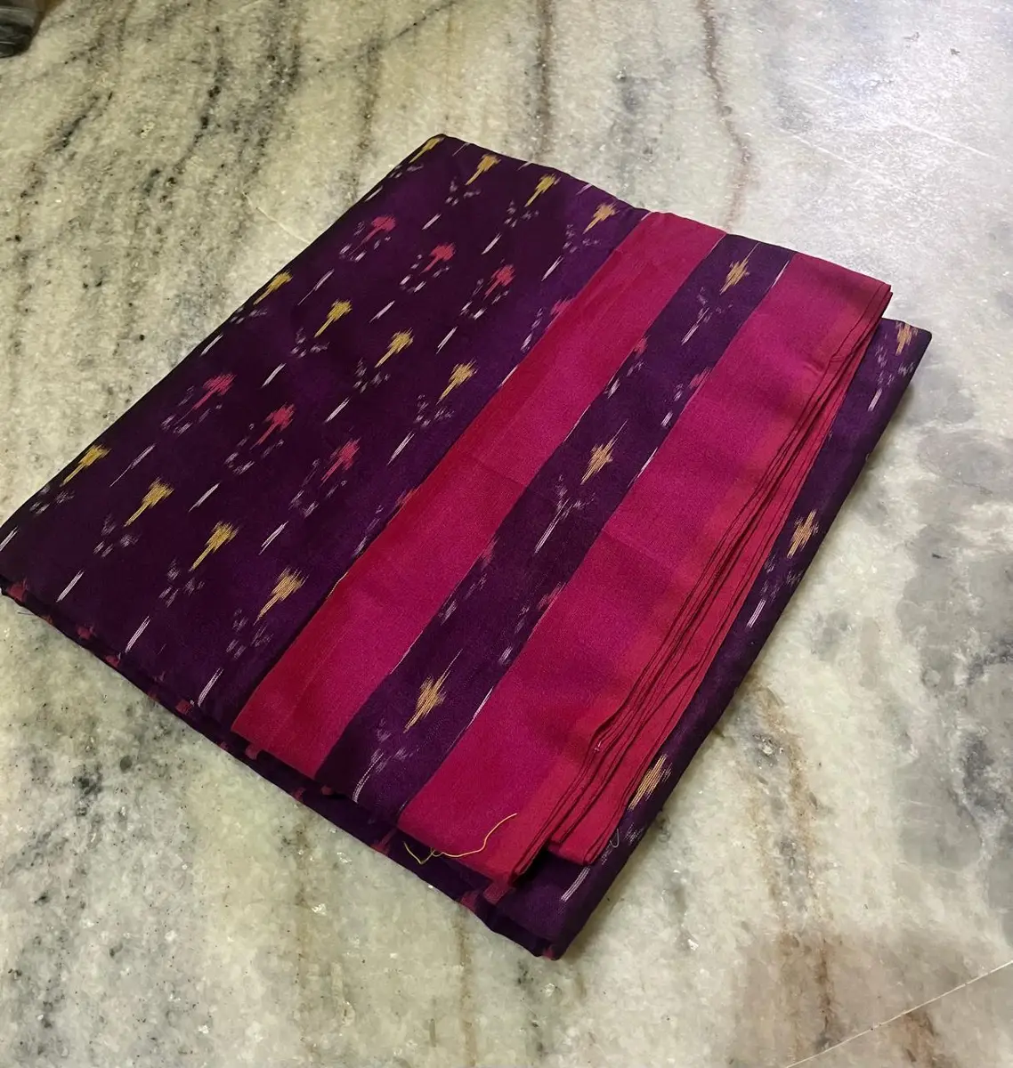 Product image: purple and magenta folded saree-like textile