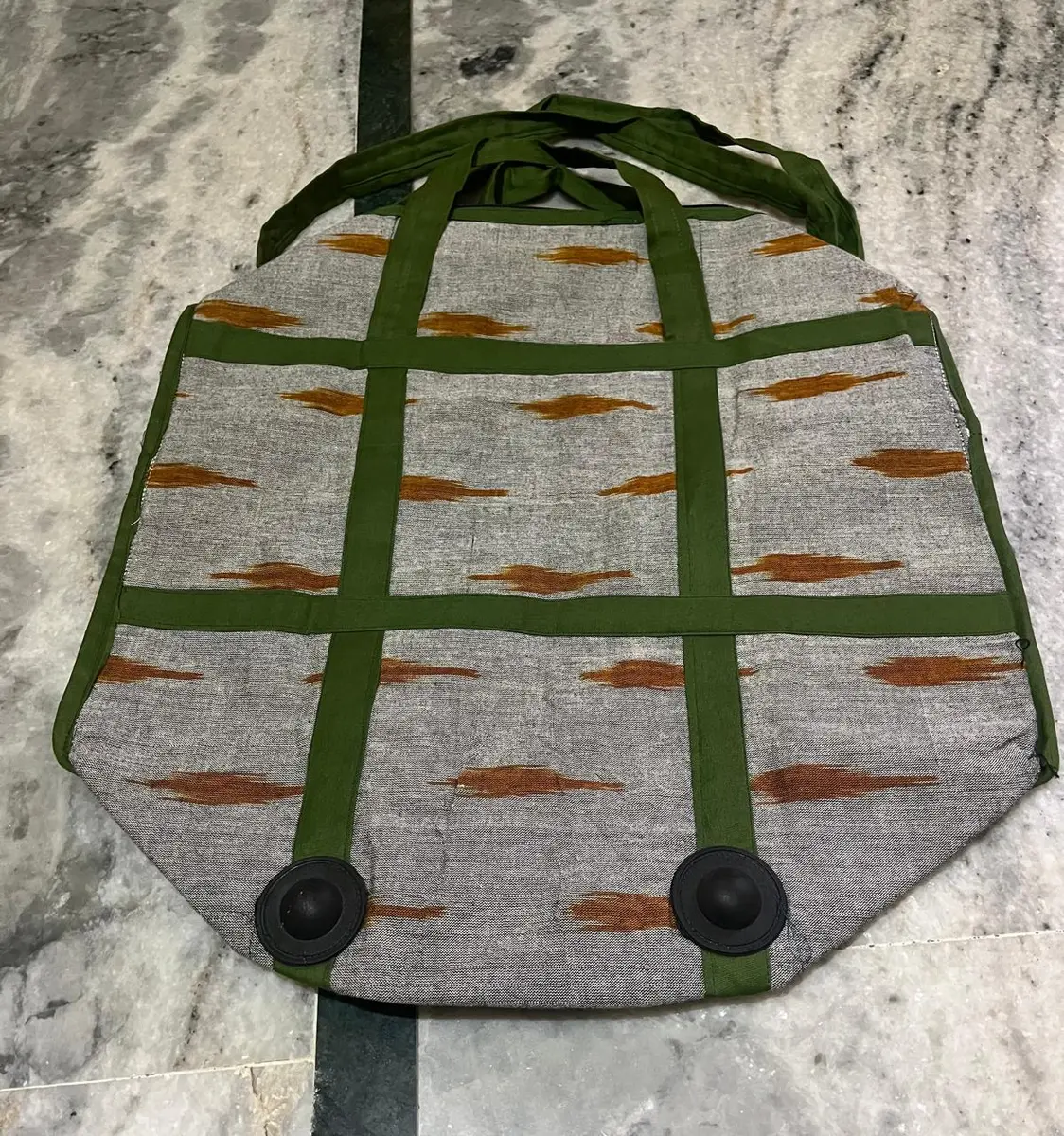 Product image: cream, green, and orange handbag
