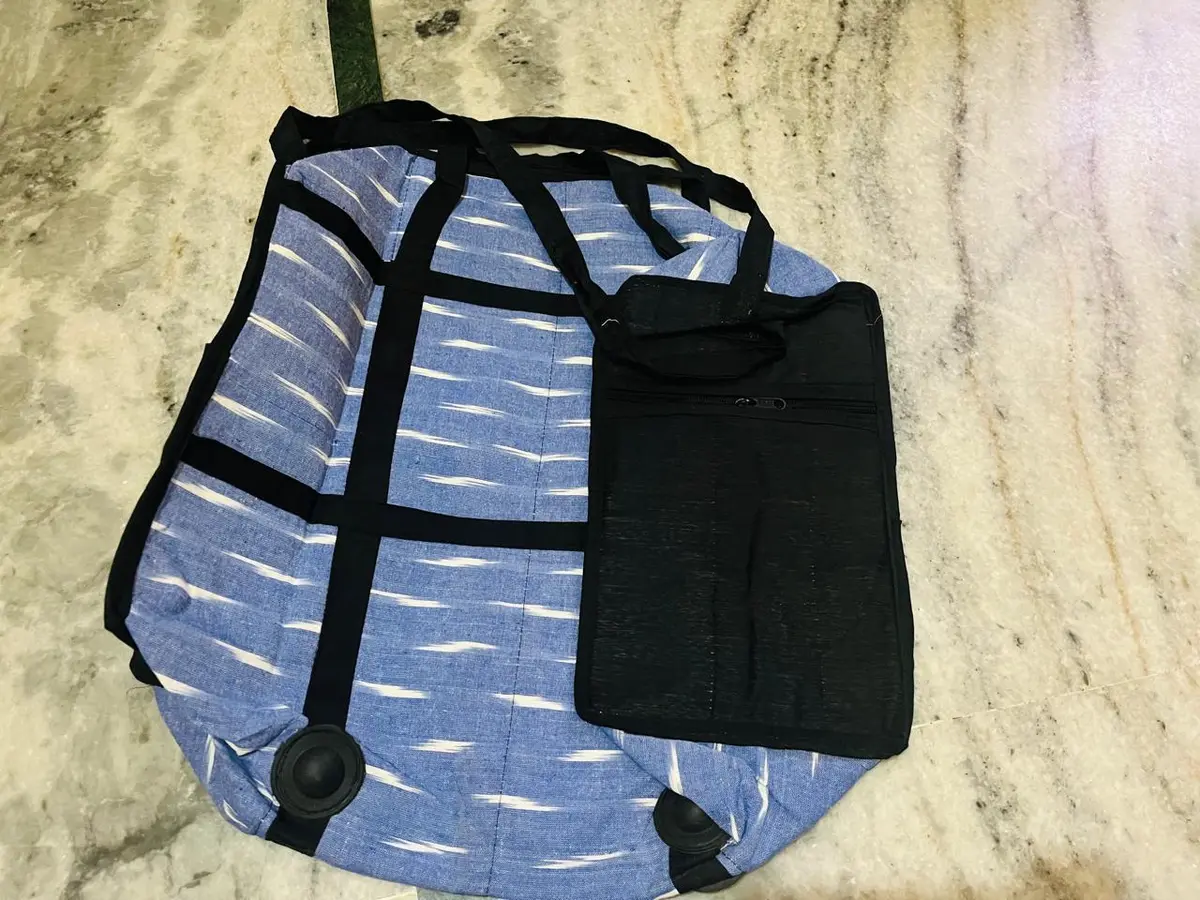 Product image: light blue and black handbag
