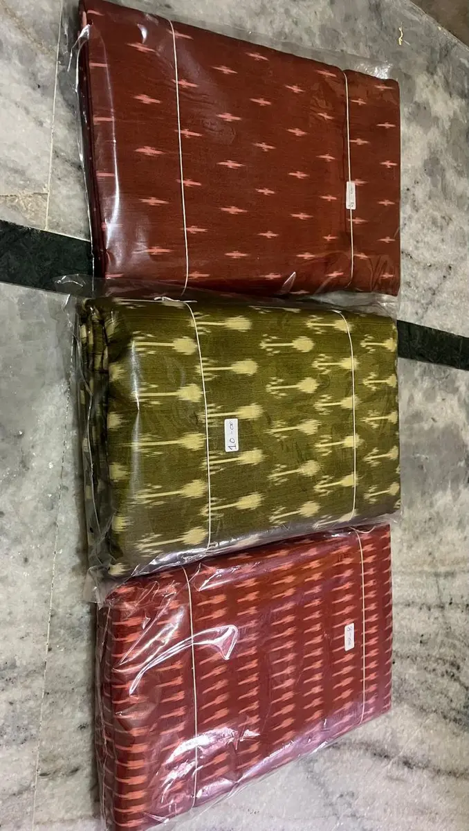 Product image: brown, olive, red, and cream stack of folded textile items