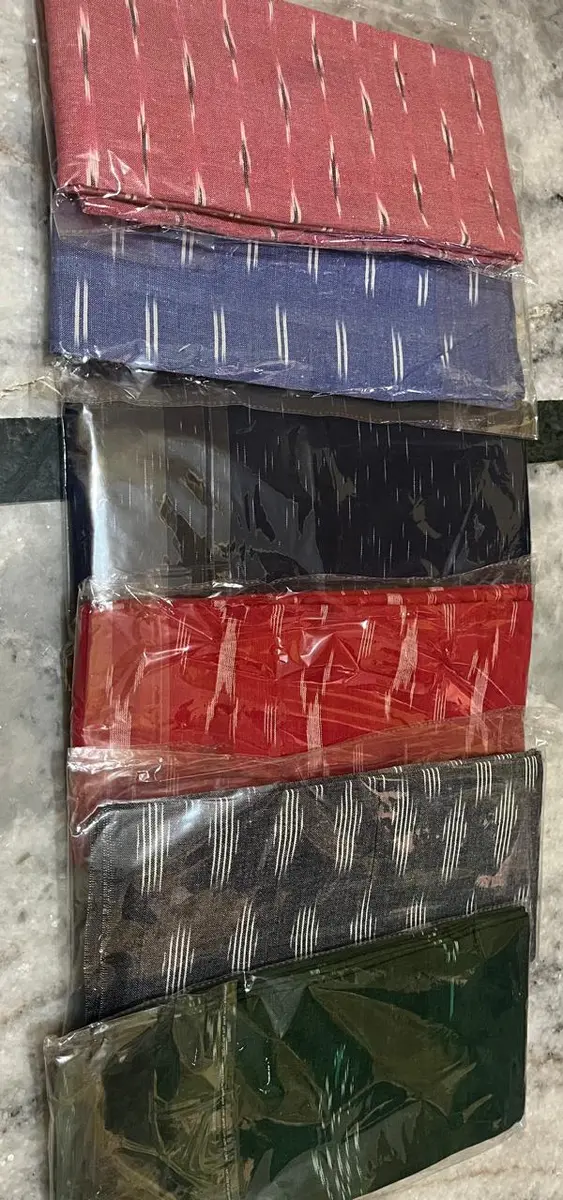 Product image: red, blue, black, and green stack of packaged textile items