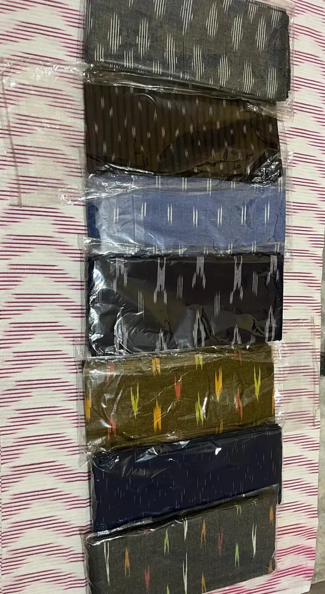 Product image: gray, olive, navy, red, and cream stack of folded textile items
